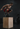 Mann in Sportkleidung führt einen Box Jump an einem Sprungkasten aus – effektives Calisthenics-Training mit dem richtigen Equipment.